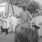 A crier calls out to buyers at a traditional Omani livestock market